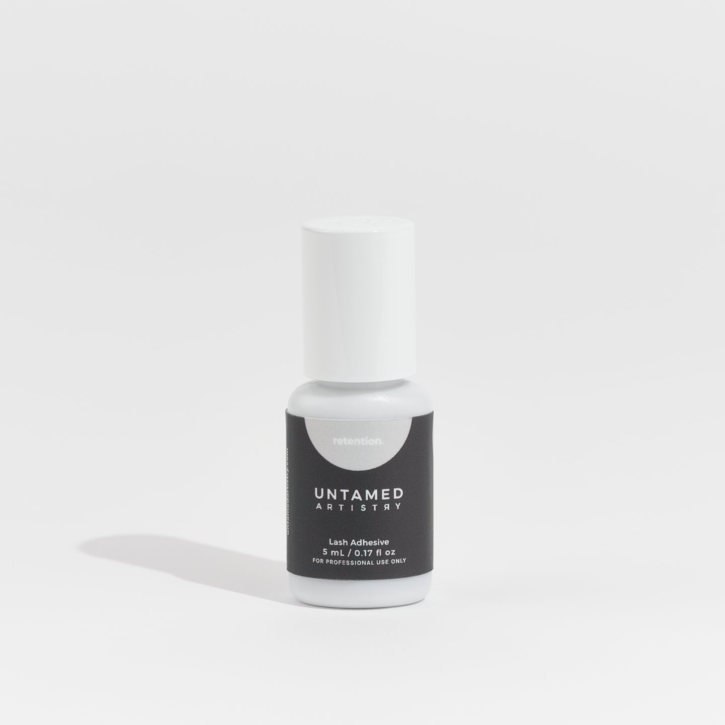 Bottle of Untamed Lacquers nail polish on a white background