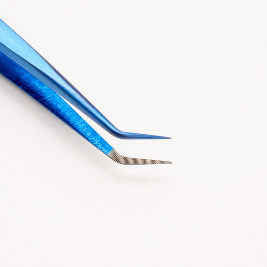 Blue tweezers on a white background