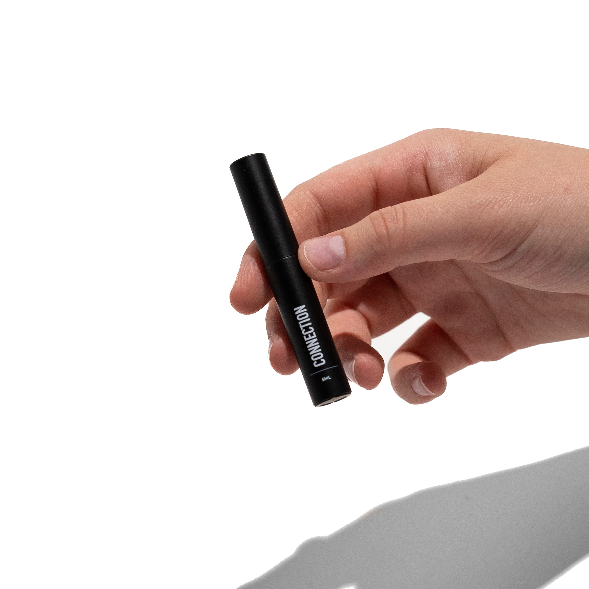 person holding temporary lash glue