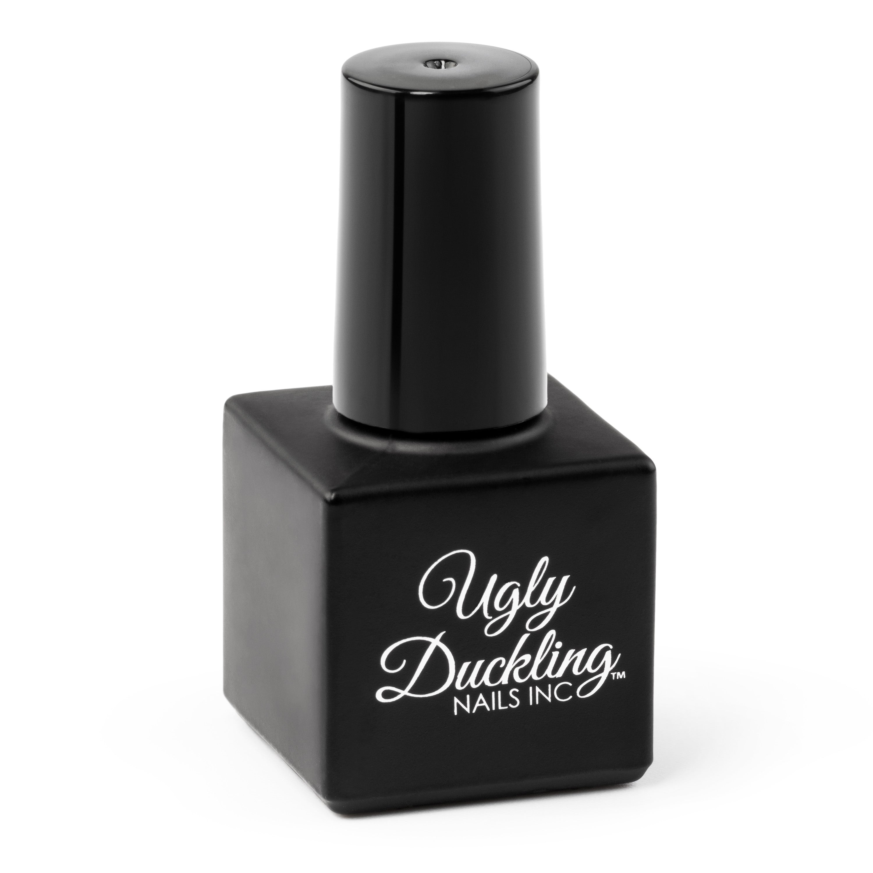 Black nail polish bottle with 'Ugly Duckling Nails Inc' text on a white background