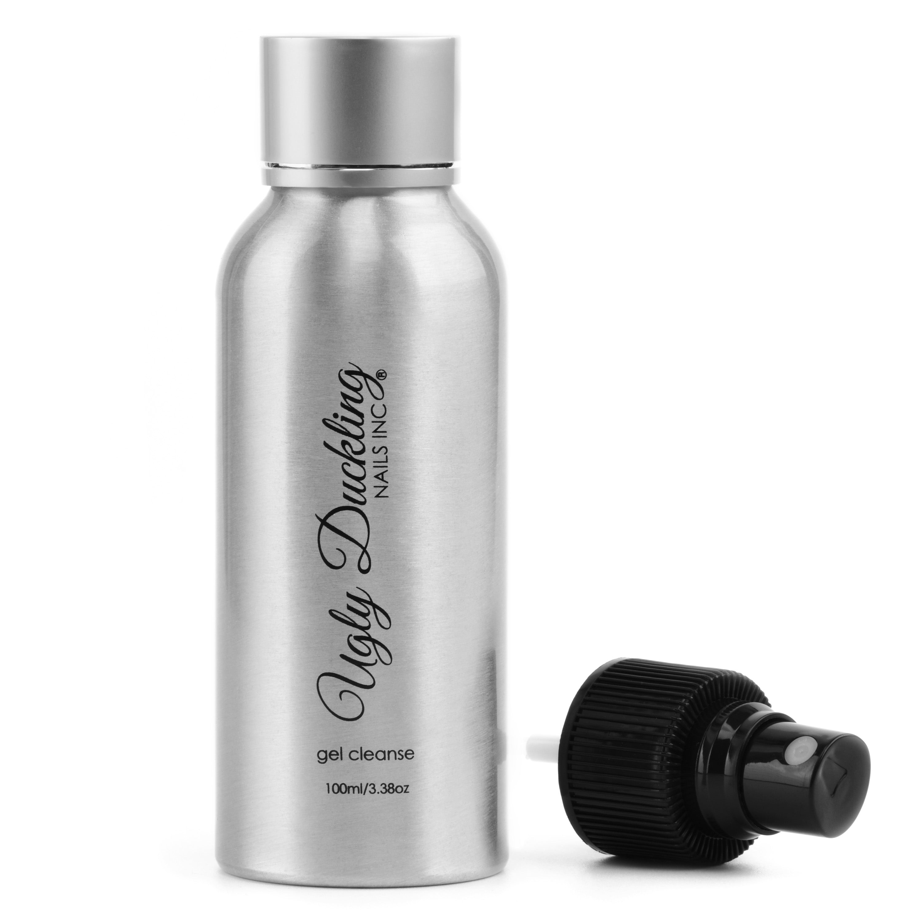 Silver bottle labeled 'Ugly Duckling Nails Inc.' with a black dropper on a white background