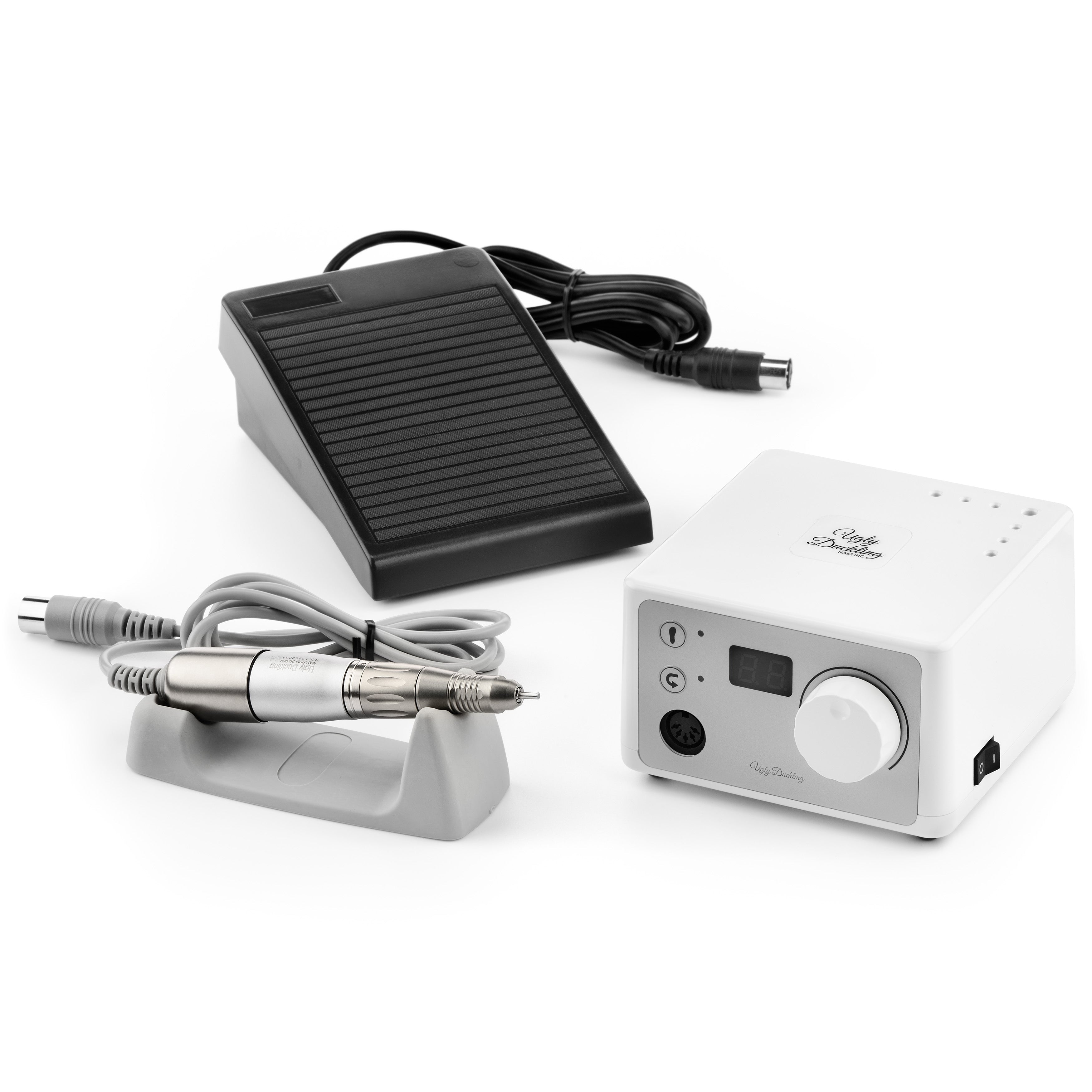 nail filing machine, foot pedal, and power adapter on a white background