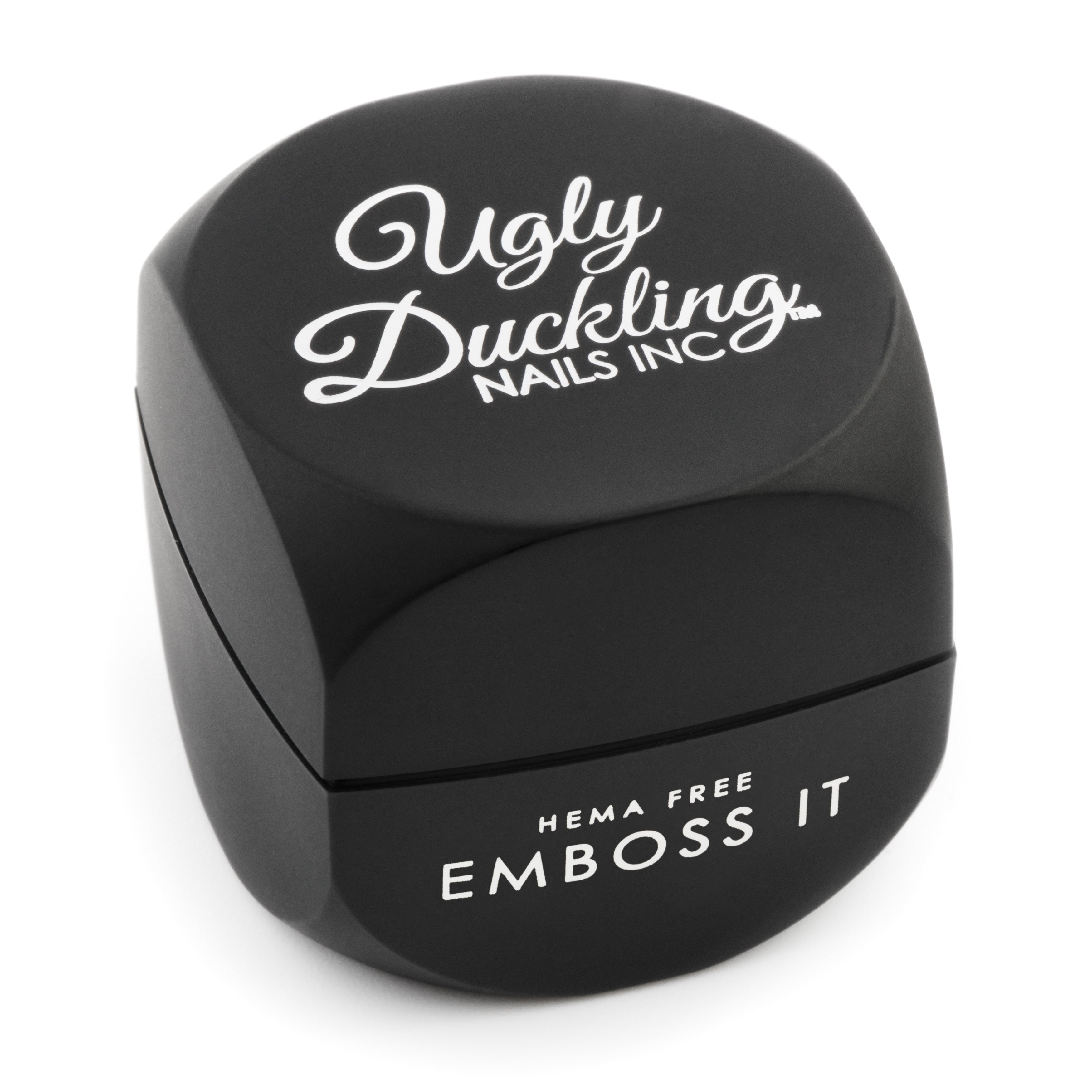 Black emboss tool with 'Ugly Duckling Nails Inc.' branding on a white background