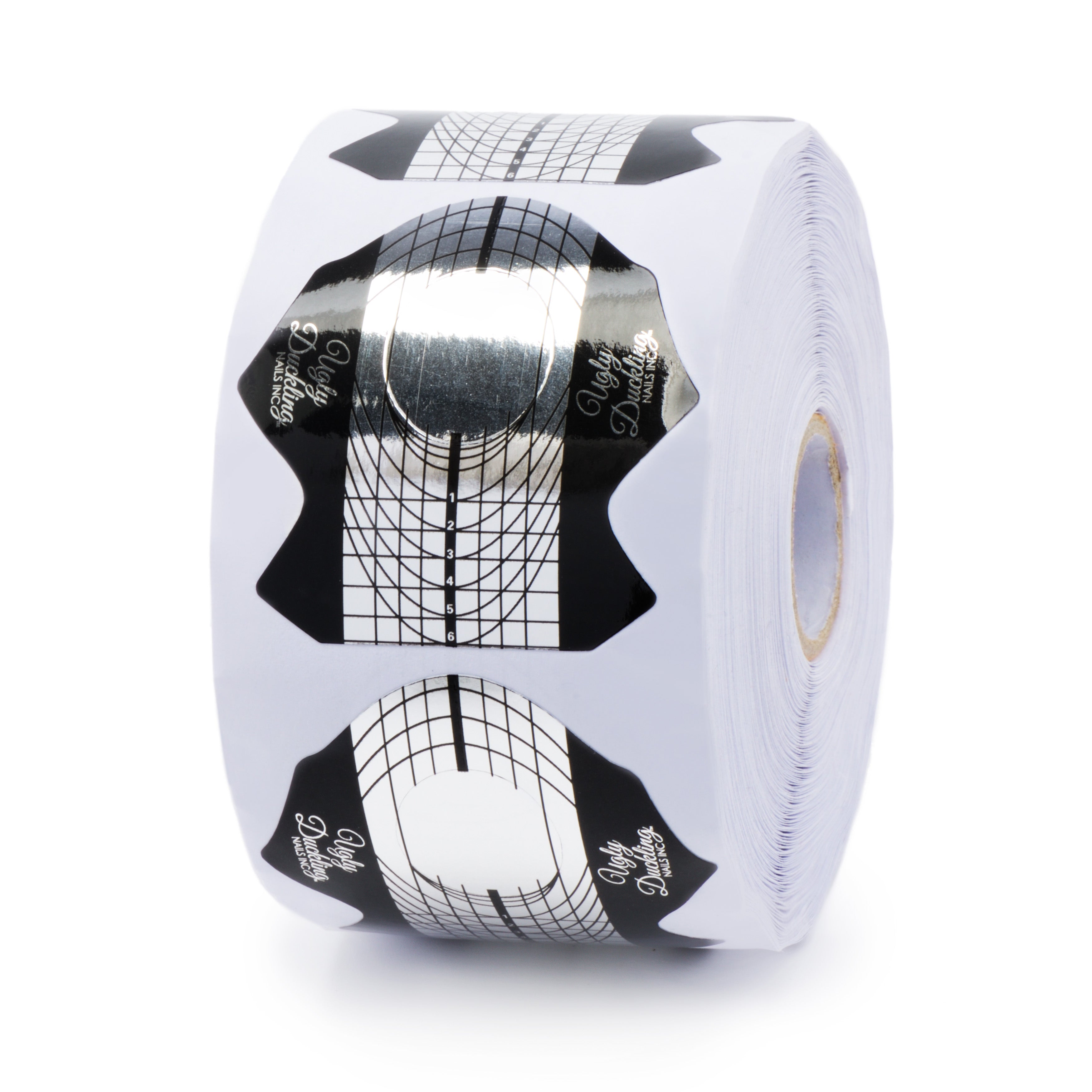 Roll of black and white patterned salon nail forms on a white background