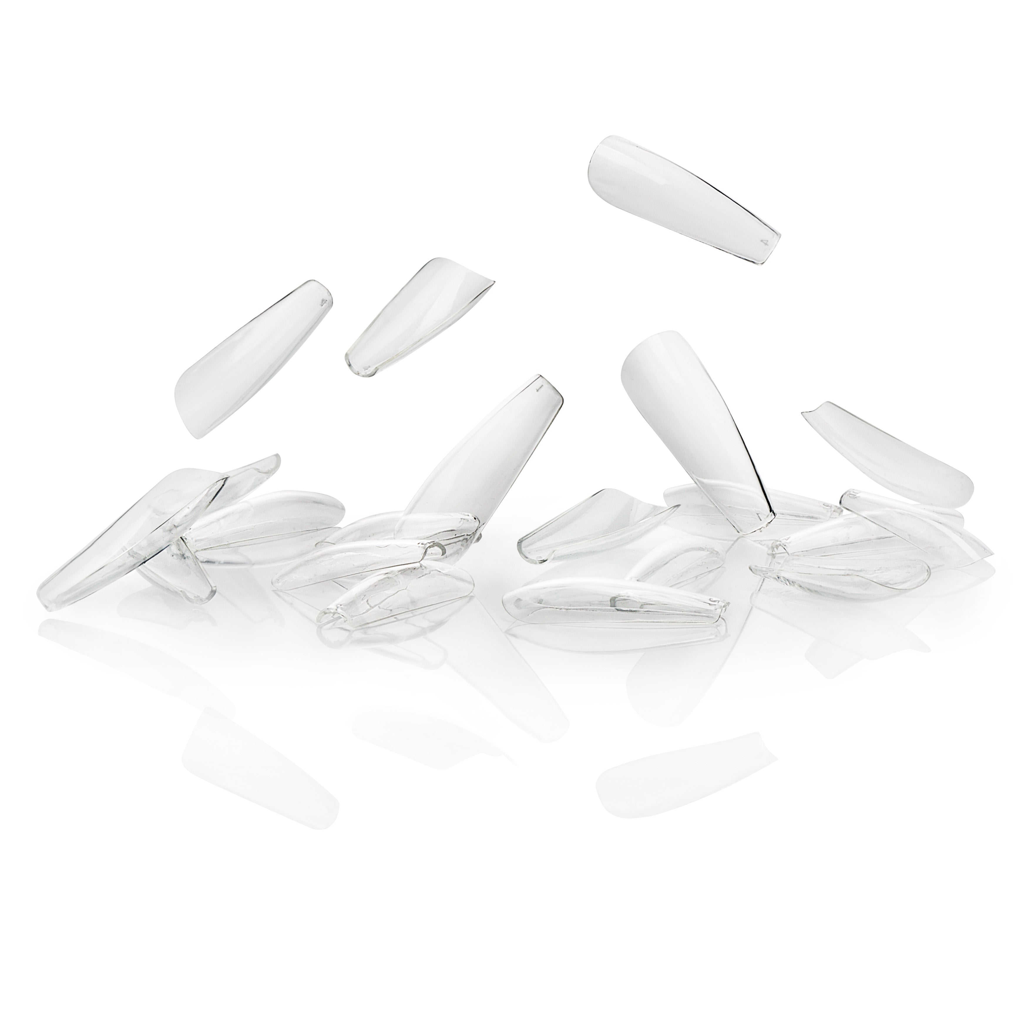 Set of clear nail tips on a white background