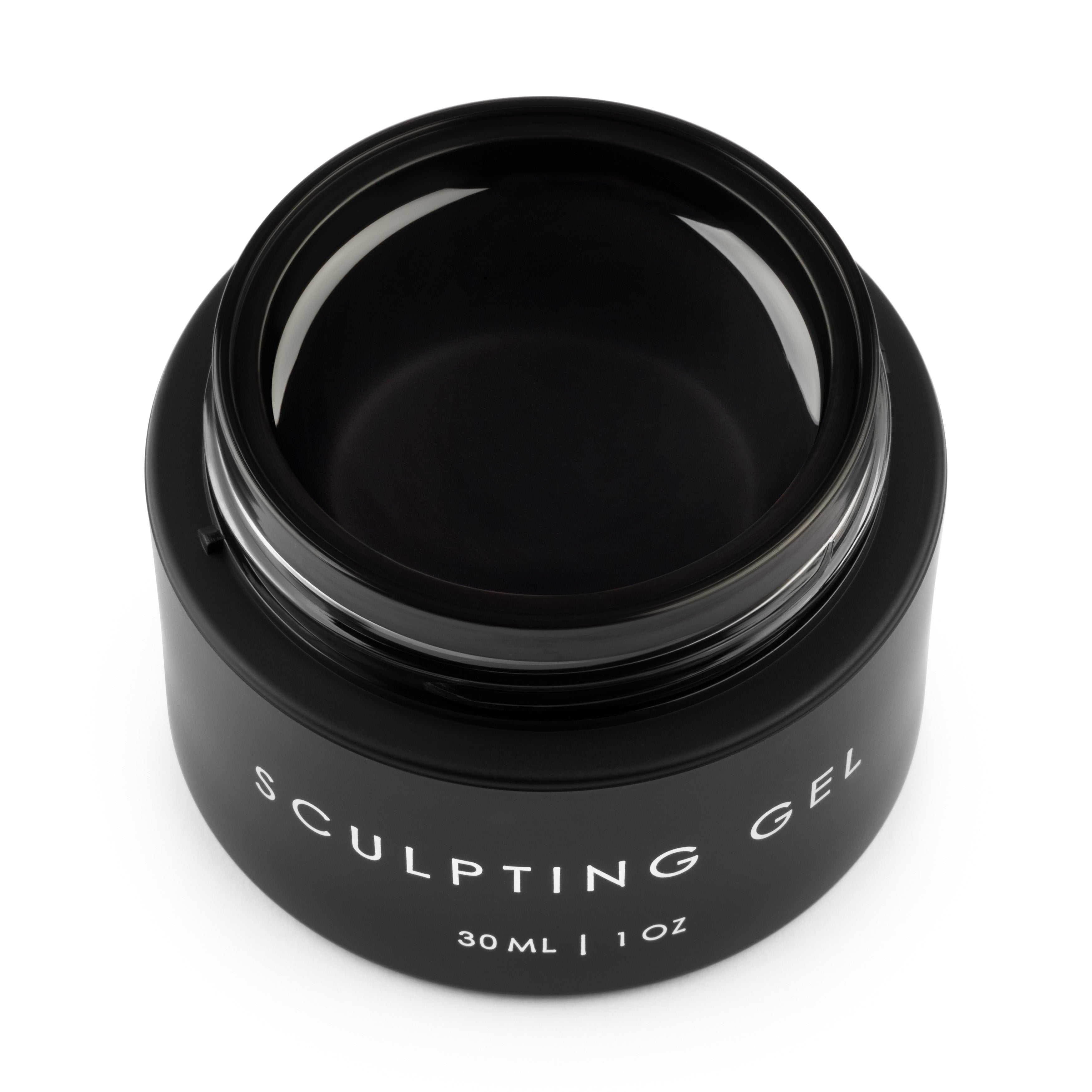 Black jar of sculpting gel for nail salon services on a white background
