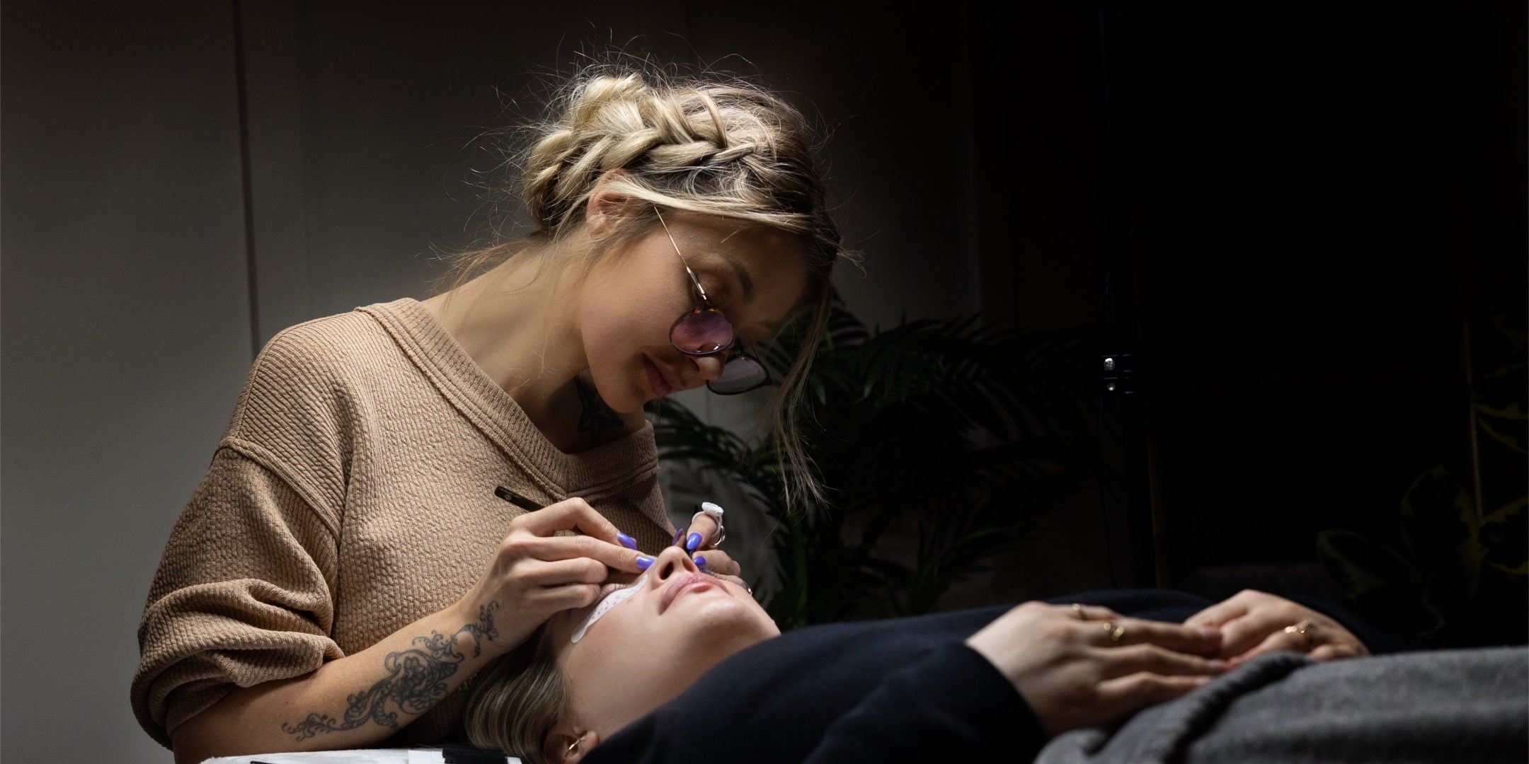 Lost Artistry: Kaitlyn applying eyelash extension to a client - Professional lash application with precision and care