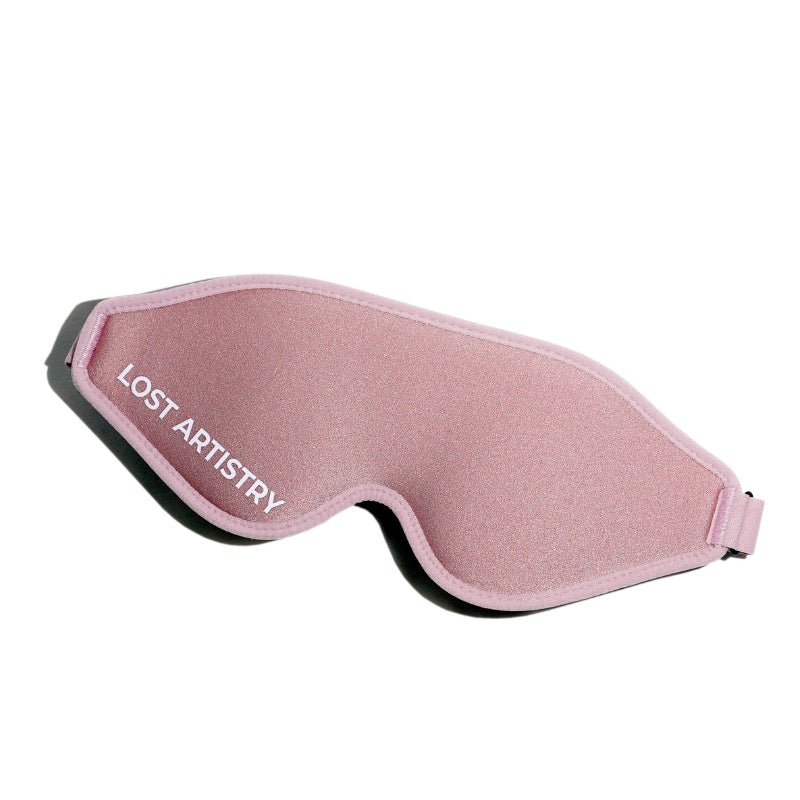 Pink sleep mask with 'Lost Artistry' branding on a white background
