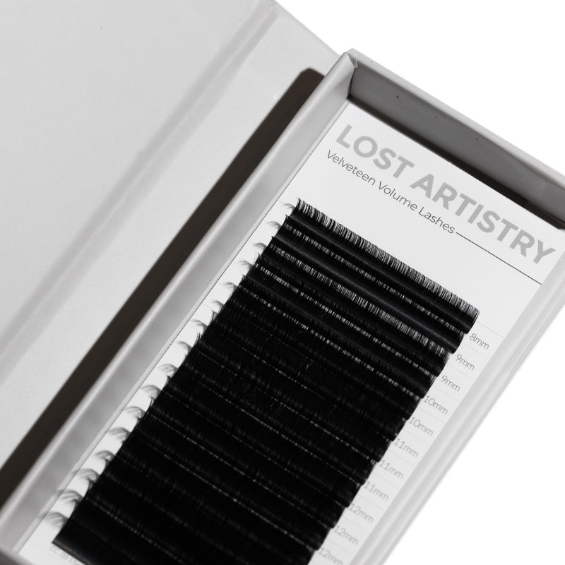 Eyelash extensions in a Lost Artistry box on a white background
